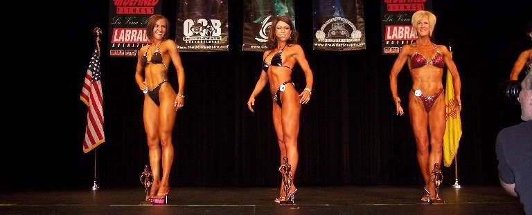 Yvonne winning the open figure medium height division.