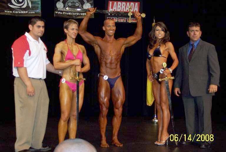 Max Muscle owner Jesus Quiroz and show promoter Lee Schaffer pose with the overall winners.